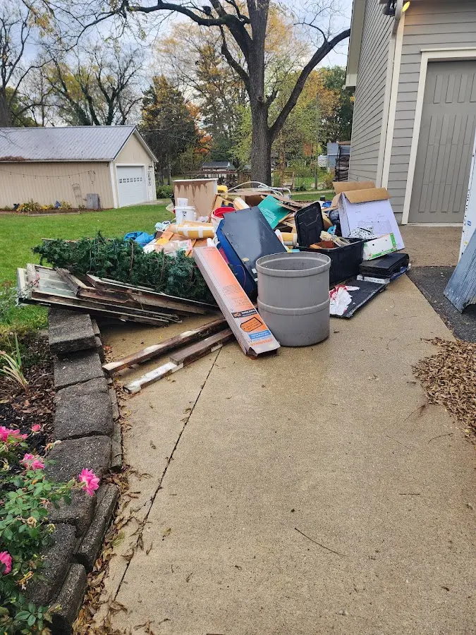 Dumpster being loaded with debris for 30 Yard Dumpster Rental in Newnan